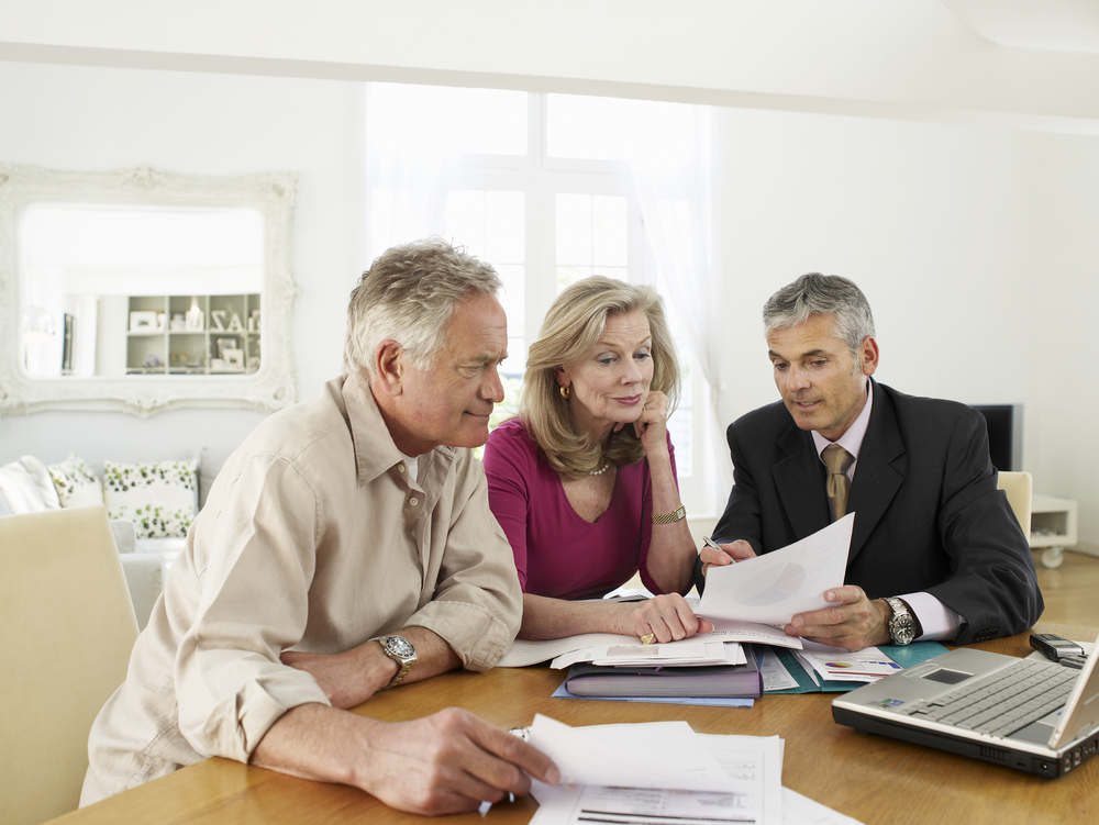 financial advisor explaining financial independence to clients