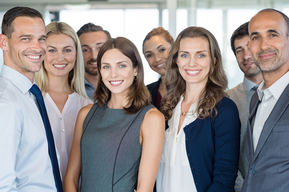 business team members posing for an office photo