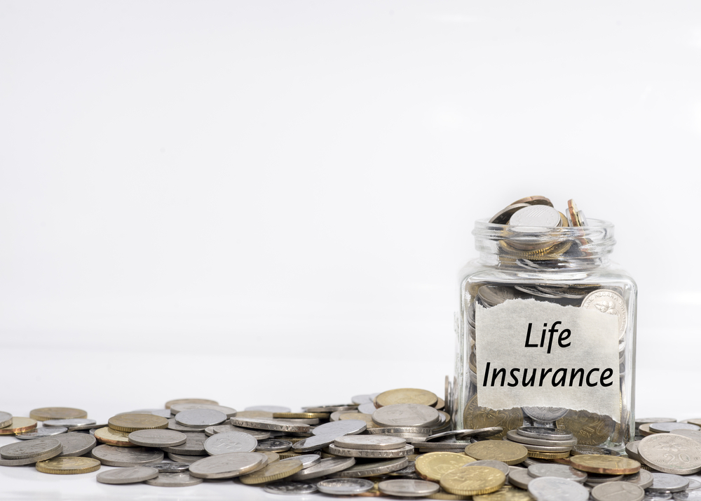 coins in a jar named life insurance