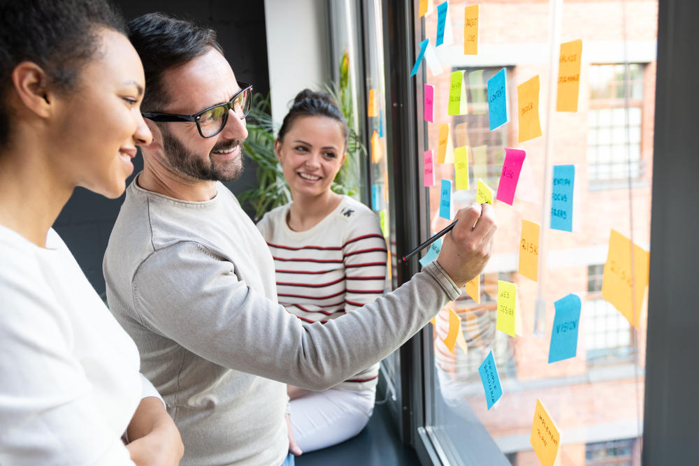 people brainstorming to name a financial services company