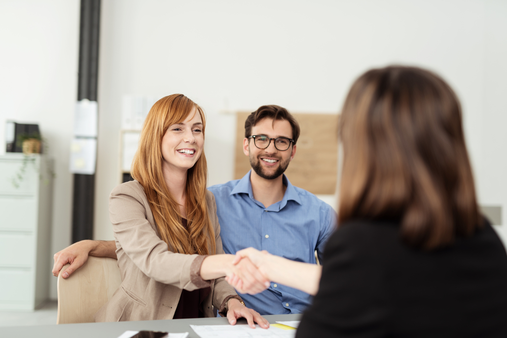 young next generation couple meeting with their financial advisor